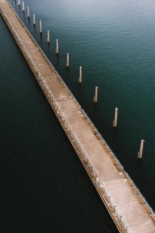 a very long bridge crossing water with no cars