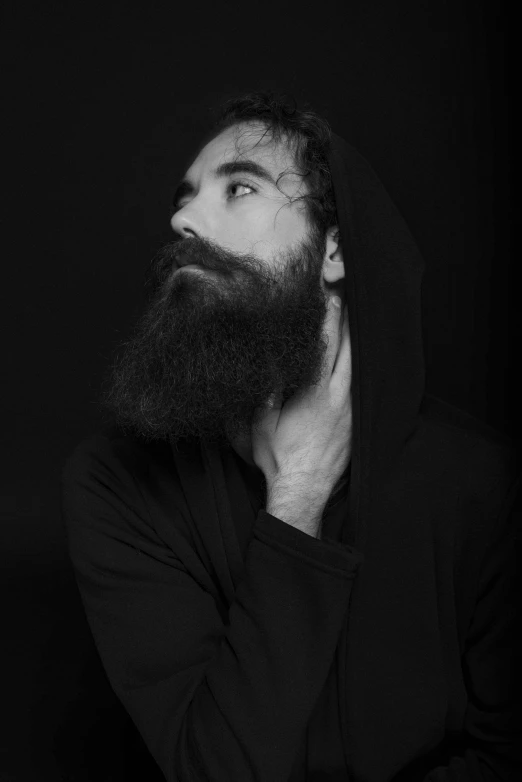 a black and white po of a man with a beard