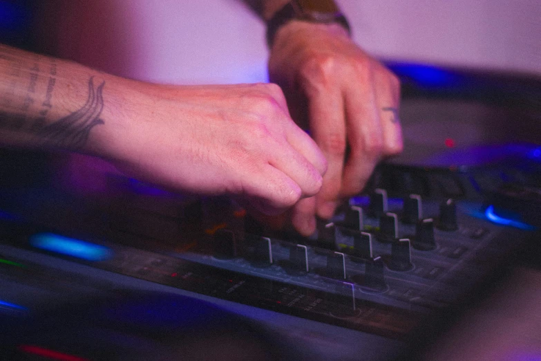 a person using a dj controller at a party