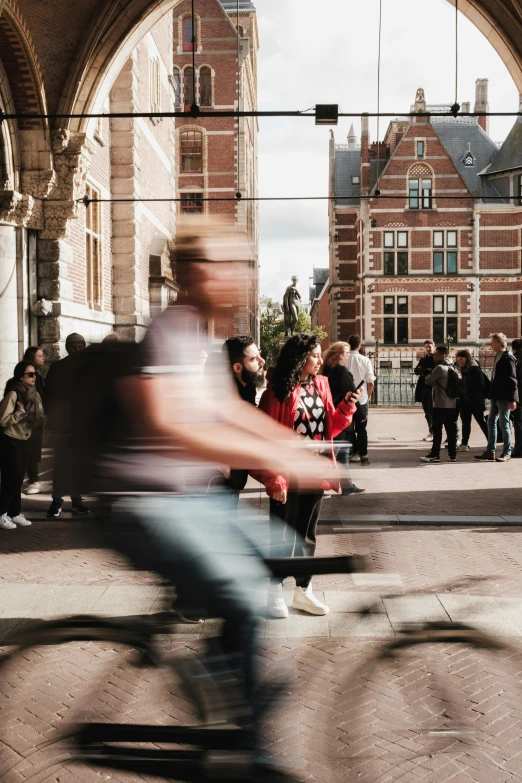 the motion blurry person is pographed across a city street