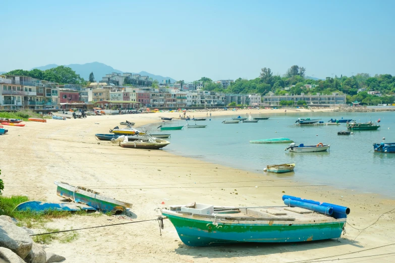 boats are parked on the beach at the ocean