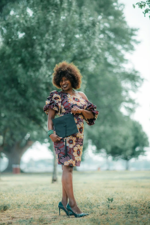 a woman with an afro wearing a short dress