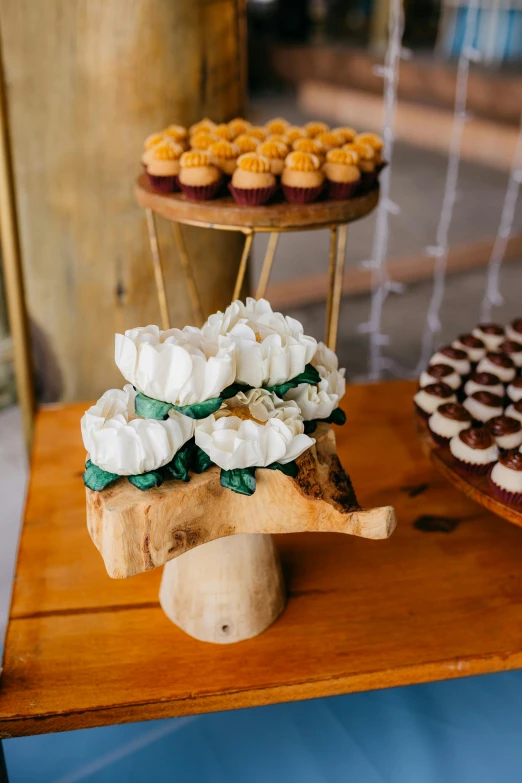 there are several cakes and pastries on the table