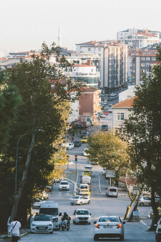 city street full of traffic and tall buildings