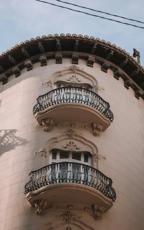 an ornate balcony overlooks the balconies on an old style building