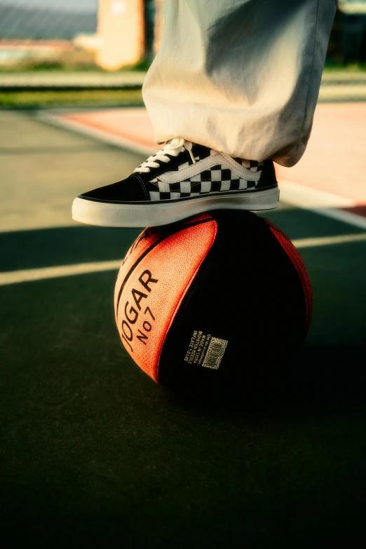 someone standing on a ball that is in the middle of the floor