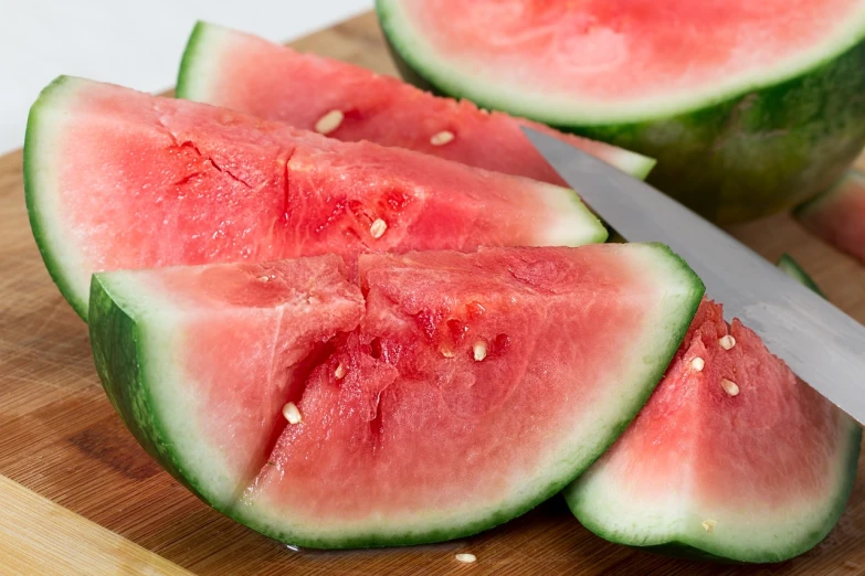 slices of watermelon on a cutting board with a knife, by Maeda Masao, high quality product image”, closeup photo, cutout, feature