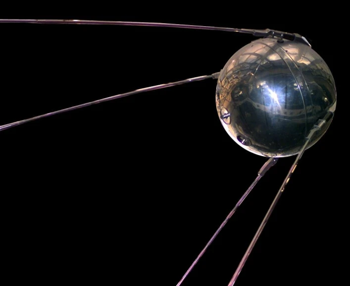 a close up of a metal object on a black background, by Vladimir Tatlin, flickr, bauhaus, with long antennae, translucent sphere, image credit nasa nat geo, solar sails