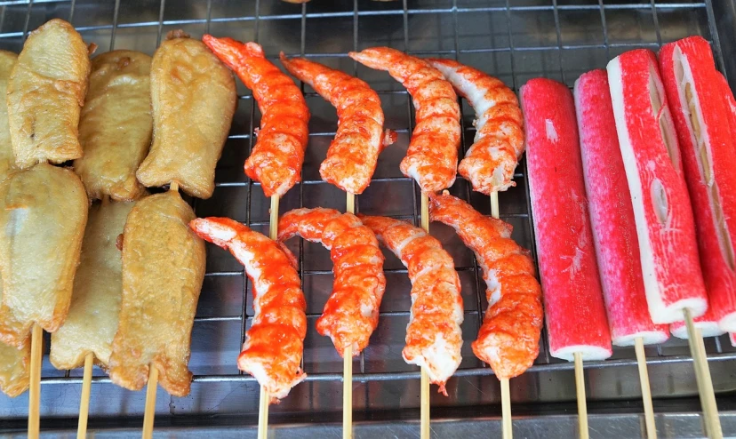 a close up of skewers of food on a grill, a pastel, sōsaku hanga, prawn, bad photo, very accurate photo, 2 0 2 2 photo