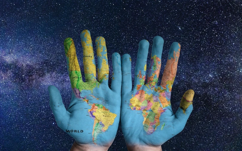 two hands painted with a map of the world, a photo, in the universe.highly realistic, avatar image, high res photo