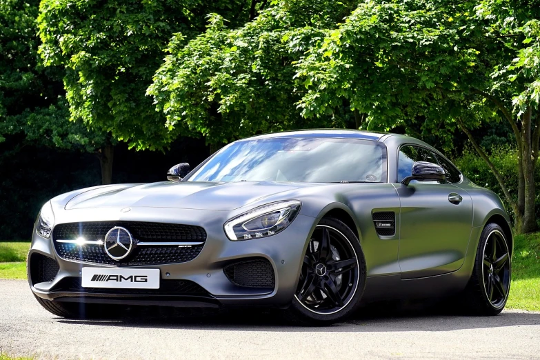 a silver mercedes sports car parked on the side of the road, a picture, by Tom Bonson, pexels, green eays, car trading game, video, frameless