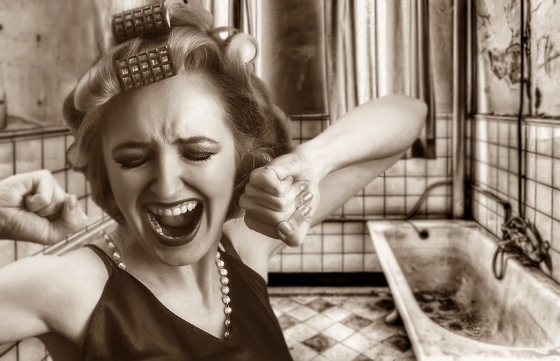 a black and white photo of a woman brushing her hair, a photo, inspired by Grete Stern, pixabay contest winner, screaming in agony, rage against the washing machine, sepia tone, in style of mike savad”