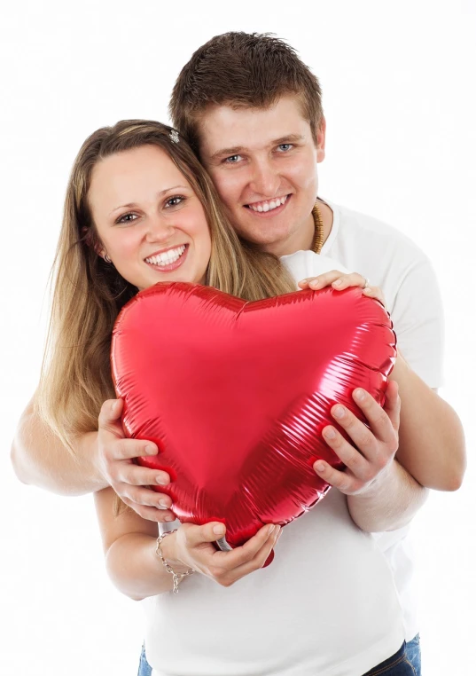 a man and a woman holding a heart shaped balloon, istockphoto, on white background, foil, hug