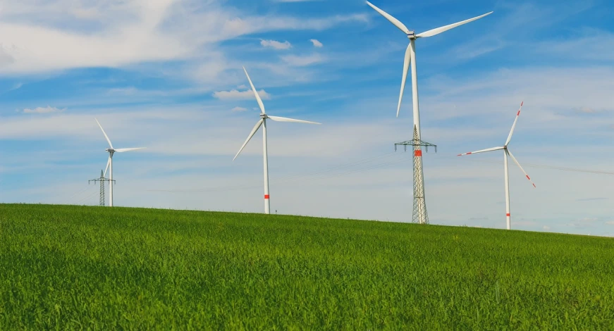 a group of wind turbines sitting on top of a lush green field, a stock photo, pexels contest winner, vertical wallpaper, high definition screenshot, green and blue colors, high quality]