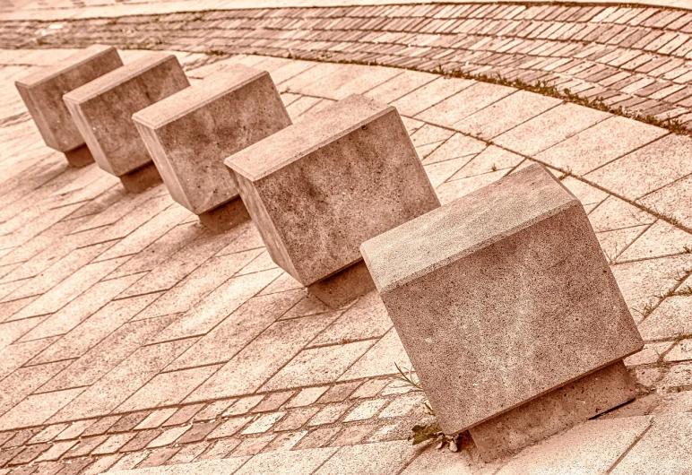 a row of concrete blocks sitting on top of a brick floor, an abstract sculpture, by Arthur Sarkissian, trending on pixabay, concrete art, sepia colors, pink marble building, steps, smooth curvilinear design