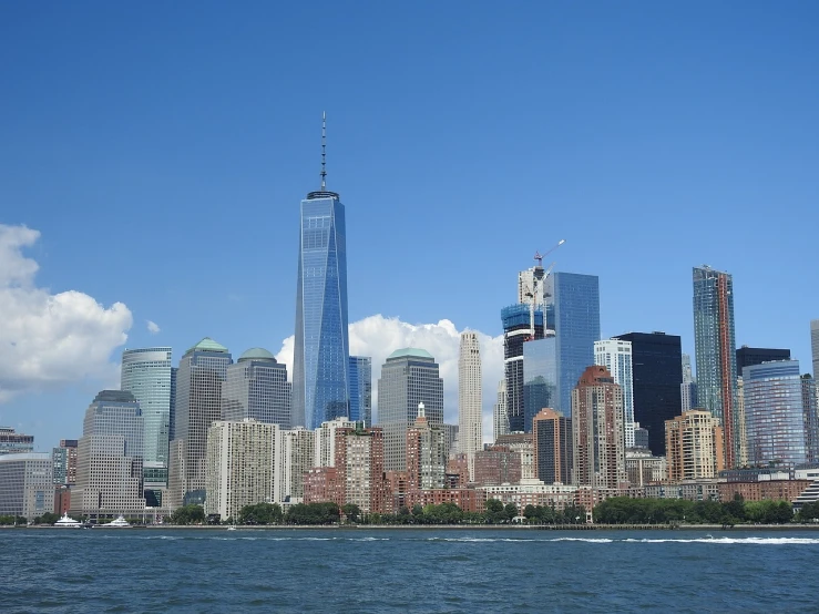 a large body of water with a city in the background, a picture, modern new york, the photo was taken from a boat, blog-photo, beautiful image