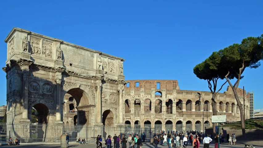 a group of people standing in front of a building, by Pogus Caesar, pexels contest winner, neoclassicism, huge giant old ruins, arcs, beautiful sunny day, 🕹️ 😎 🔫 🤖 🚬