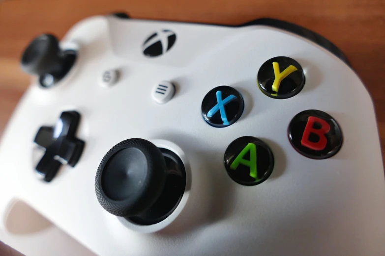 a close up of a video game controller, a picture, by Tom Carapic, xbox, white mechanical details, closeup - view, colour