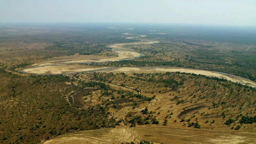 an aerial view of a river running through a forest, hurufiyya, on the african plains, movie set”, high res, jakob eirich