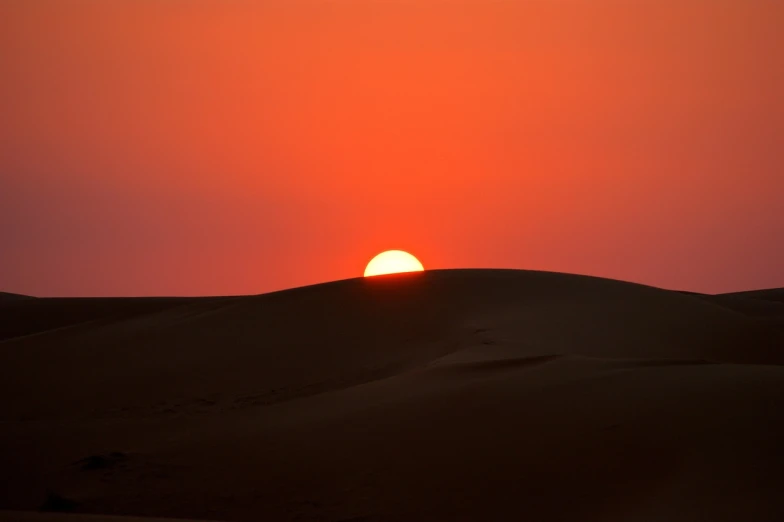 the sun is setting over the sand dunes, by Kamāl ud-Dīn Behzād, flickr, hurufiyya, big red sun, shan shui, sufism, the sun is setting