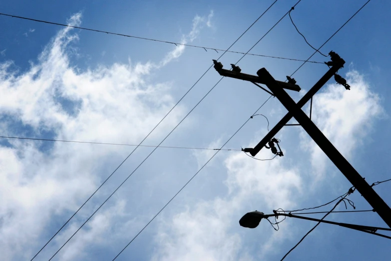 power lines and telephone poles against a blue sky, dada, istockphoto, dark cables hanging from ceiling, file photo, dramatic ”