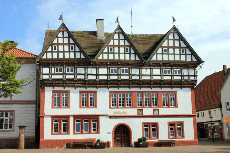 a large white and red building with lots of windows, heidelberg school, medieval house, in dunwall, town hall, rural