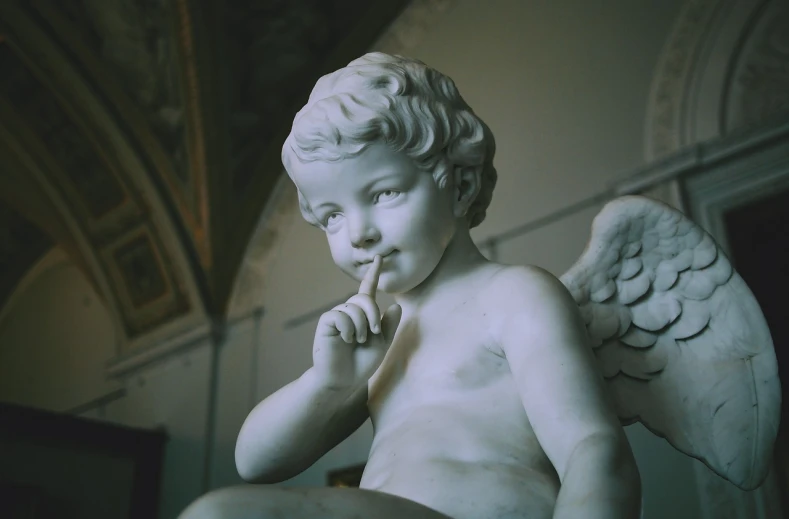 a close up of a statue of an angel, by Correggio, pexels, taking a smoke break, white marble interior photograph, cute boy, shot on nicon camera