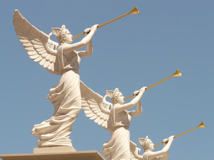 a couple of statues that are on top of a building, a statue, inspired by Kurt Wenner, neoclassicism, joyous trumpets, great wings, las vegas, wikimedia commons