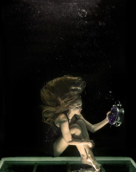 a woman that is in the water with a camera, cg society contest winner, conceptual art, on black background, aquarius, hourglass, deep dark purple waters