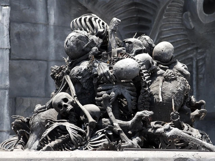 a statue of a group of skeletons in front of a building, a statue, featured on zbrush central, gothic art, mexico city, piles of bodies, closeup!!!!!!, bloodborne cathedral