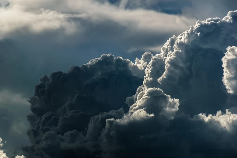 a jetliner flying through a cloudy sky, a picture, by Hans Schwarz, shutterstock, romanticism, towering cumulonimbus clouds, dramatic closeup composition, heaven and hell, whorl. clouds