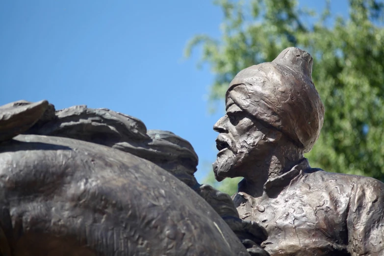 a statue of a man riding on the back of a horse, a statue, inspired by Kamāl ud-Dīn Behzād, new sculpture, close up of face, sufism, yaroslav tokar, over the shoulder closeup