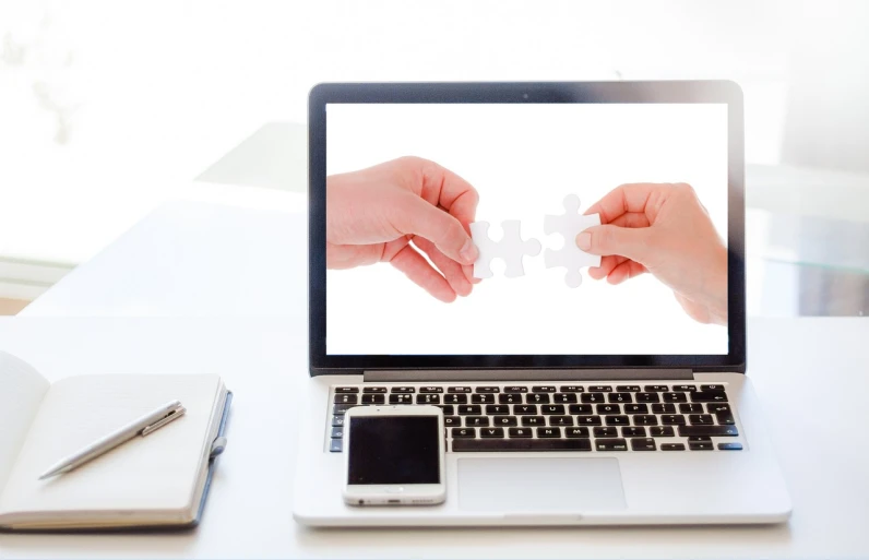 a laptop computer sitting on top of a white desk, a digital rendering, shutterstock, puzzle, across holding a hand, white bg, connected