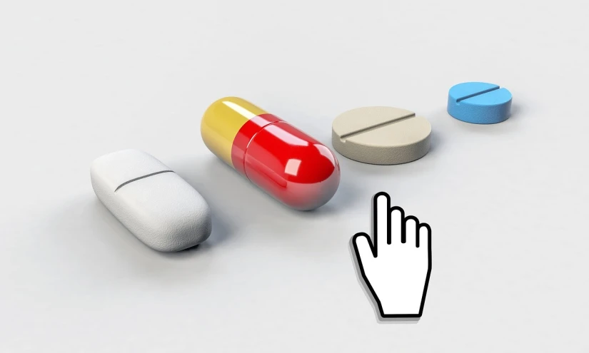 a bunch of pills sitting on top of a table, an illustration of, by Krzysztof Boguszewski, trending on pixabay, digital art, with index finger, inspect in inventory image, looking to the right, detailed and realistic hands