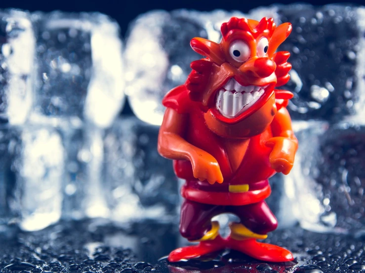 a close up of a toy with ice cubes in the background, a macro photograph, inspired by Adriaen Hanneman, cheeky devil, troll, miniature product photo, cartoons