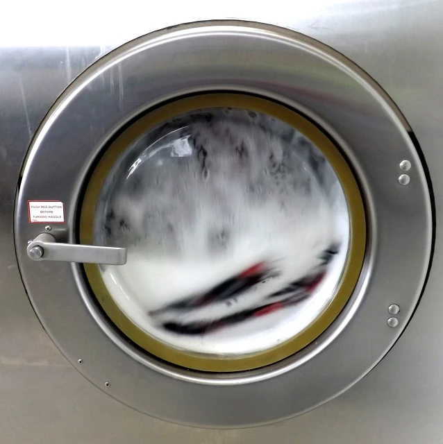a close up of the inside of a washing machine, a stock photo, process art, rushing water, [ realistic photo ]!!, museum quality photo, a round minimalist behind