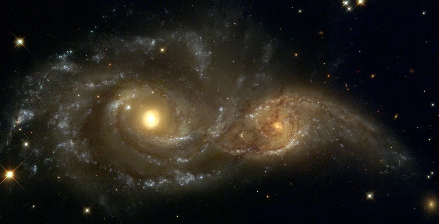 a couple of spirals that are in the sky, flickr, space art, galaxies visible, golden, facing each other, taken through a telescope