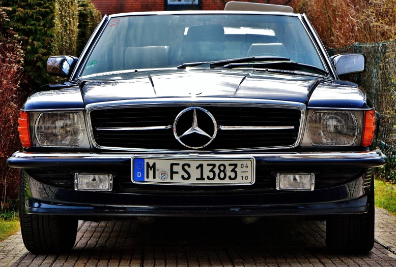 a black mercedes benz benz benz benz benz benz benz benz benz benz benz benz benz benz benz, by Alexander Bogen, trending on pixabay, renaissance, taken in the late 1980s, friendly face, kodakchrome : : 8 k, convertable