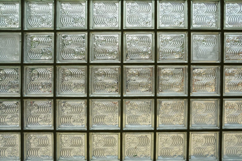 a fire hydrant sitting in front of a glass block wall, inspired by Richard Artschwager, art deco, repeating pattern, closeup photo, silver light, many windows