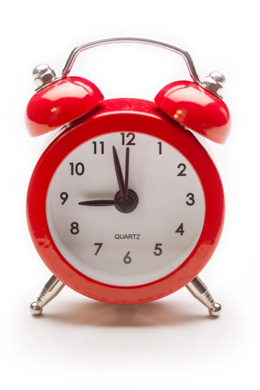 a red alarm clock sitting on top of a table, happening, set against a white background, photo - shot, istockphoto, test