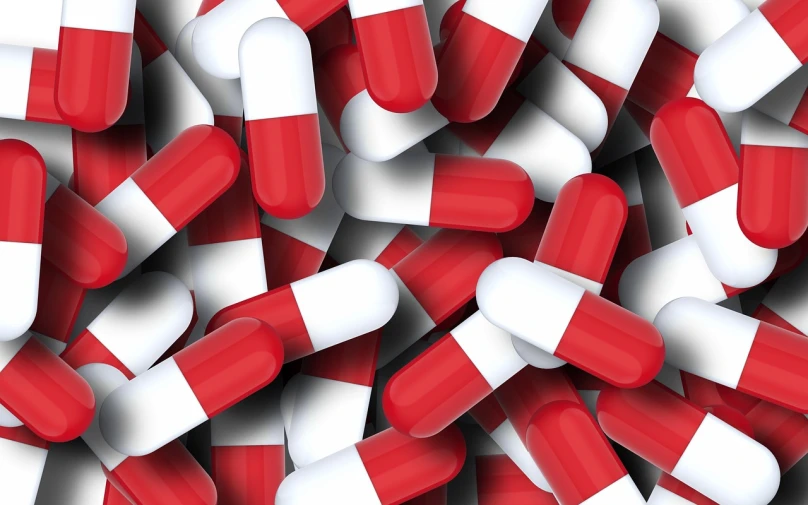 a large pile of red and white pills, a picture, shutterstock, cell bars, made with photoshop, high res photo