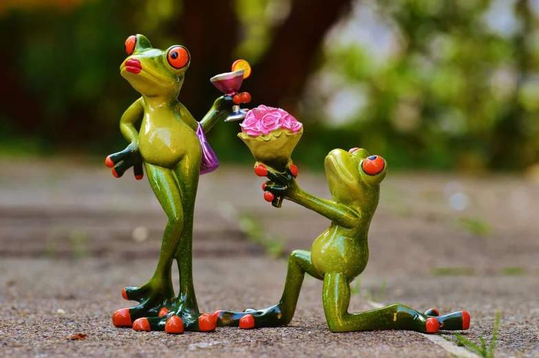 a figurine of a frog giving a flower to another frog, a picture, by Zoran Mušič, pexels, visual art, man proposing his girlfriend, on his hind legs, resine figure, 💣 💥