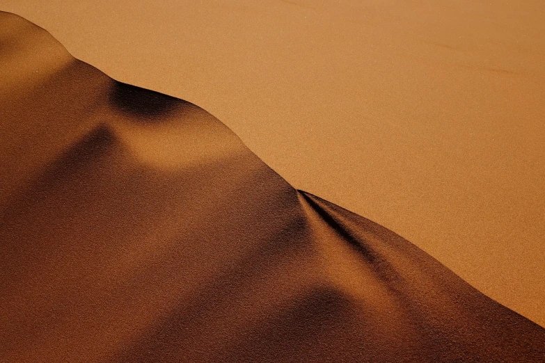 a close up of a sand dune in the desert, by Etienne Delessert, flickr, flowing salmon-colored silk, chocolate, very sharp and detailed photo, very sharp photo