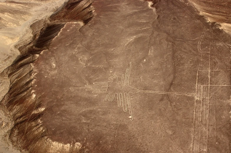 a large rock in the middle of a desert, an ultrafine detailed painting, flickr, land art, nazca design, carved floor, that resembles a bull\'s, more details