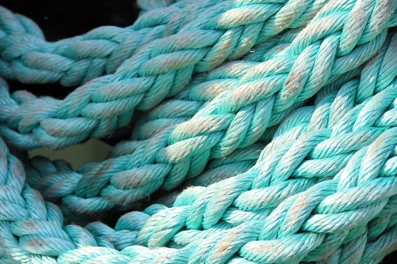a close up of a rope on a boat, by Richard Carline, shutterstock, process art, seafoam green, extremely high detail, large chain, teals