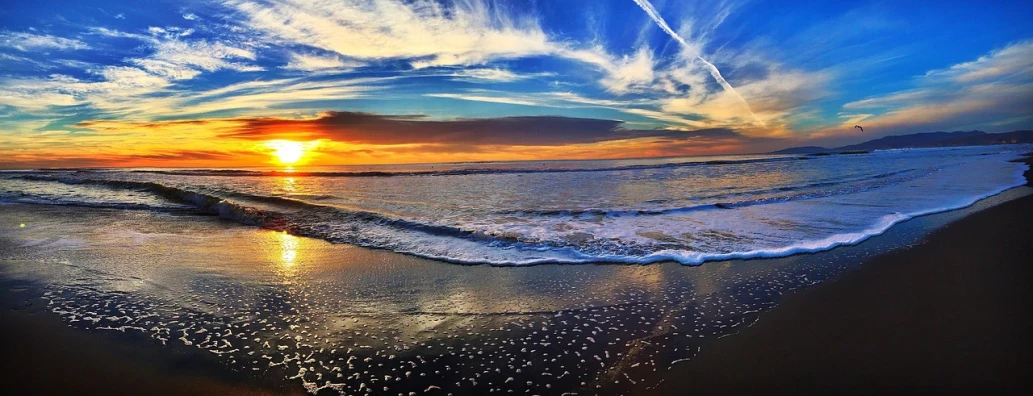 the sun is setting over the ocean on the beach, a picture, by Matt Cavotta, bright colors ultrawide lens, shot on iphone 6, panoramic shot, california coast