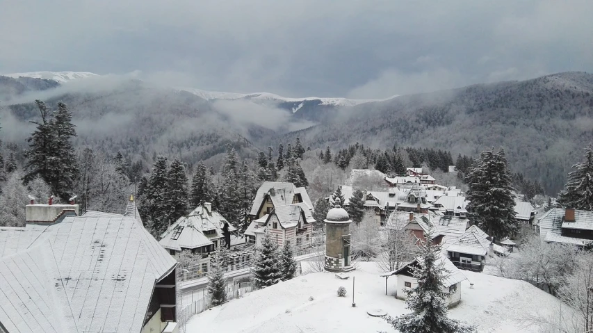 a view of a town in the mountains covered in snow, by Hristofor Žefarović, vacation photo, bogna gawrońska, cute:2, heaven on earth