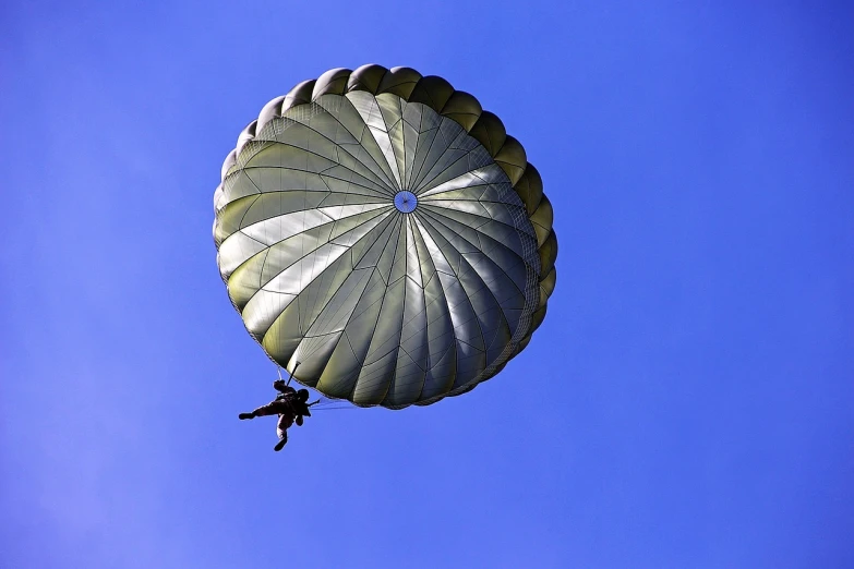 a person that is in the air with a parachute, by Jan Rustem, pixabay, military gear, proper shading, chris moore”