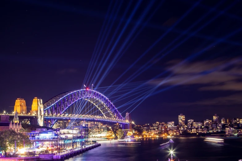 a view of the sydney harbour bridge at night, a hologram, pexels contest winner, laser light show, concert, 4k photo”, national geographic style”