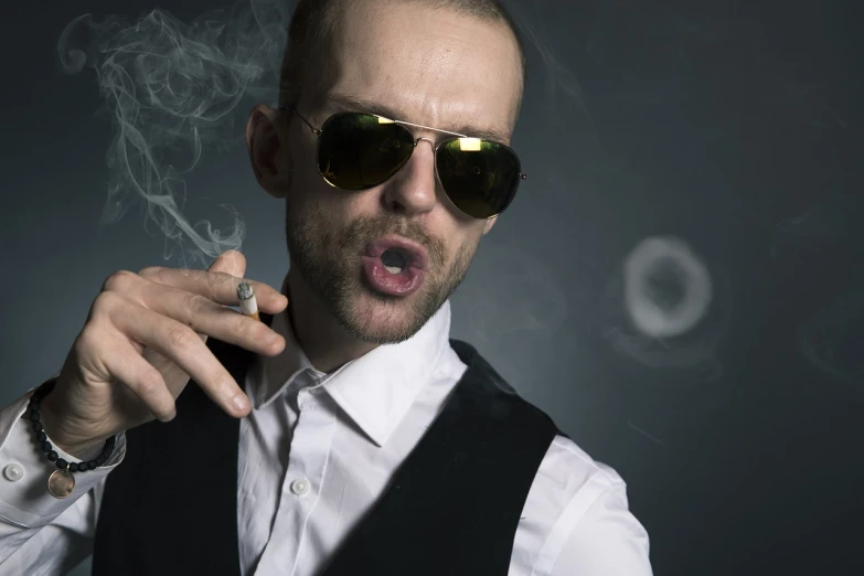 a man wearing sunglasses smoking a cigarette, a portrait, inspired by David Begbie, shutterstock, neo-dada, funny professional photo, skinny male magician, cool marketing photo, portrait of ernest khalimov